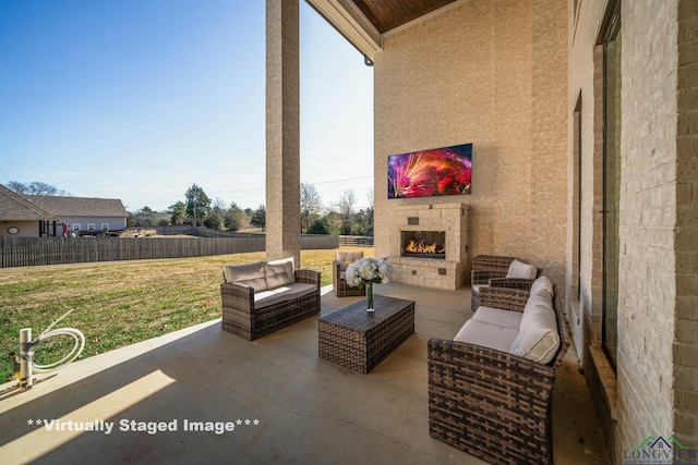 view of patio / terrace featuring an outdoor living space with a fireplace