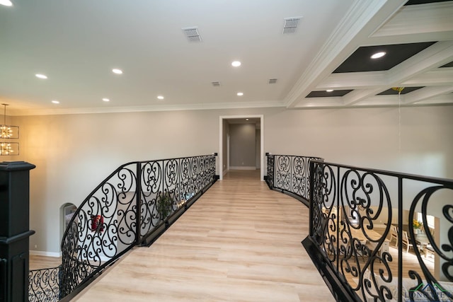 hall with a chandelier, crown molding, beam ceiling, and light hardwood / wood-style flooring