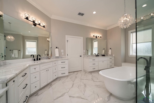 bathroom featuring ornamental molding, a tub to relax in, vanity, and a chandelier