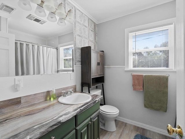 bathroom with vanity, a shower with shower curtain, toilet, ornamental molding, and wood-type flooring