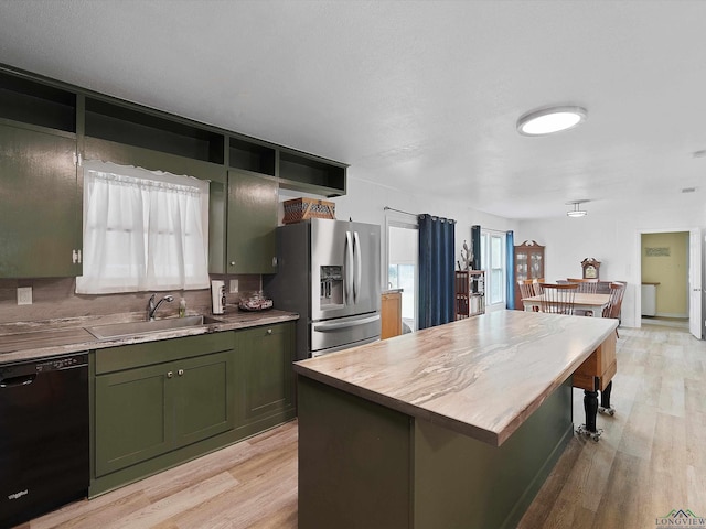 kitchen with sink, dishwasher, stainless steel fridge with ice dispenser, a center island, and green cabinets