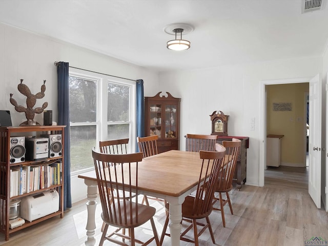 dining room with light hardwood / wood-style flooring