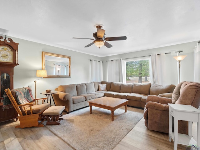 living room featuring light wood-type flooring and ceiling fan