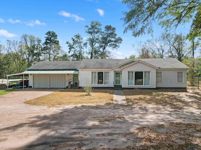 ranch-style home with a carport