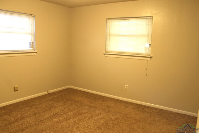 unfurnished room featuring carpet