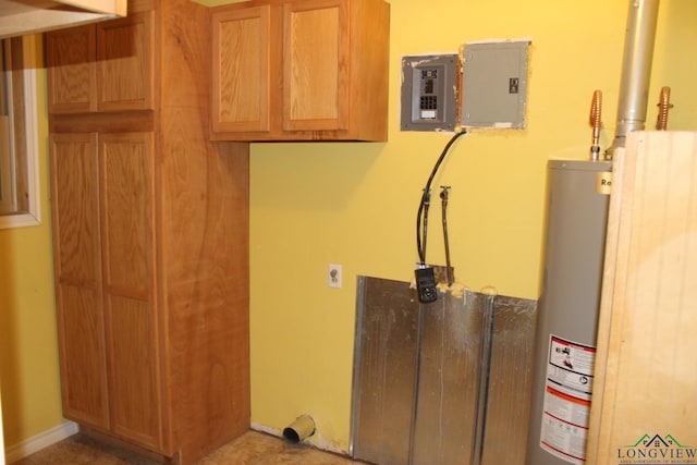 laundry area featuring cabinets, gas water heater, and electric panel