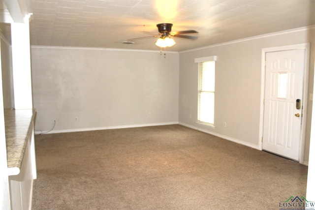 unfurnished room with carpet flooring, ceiling fan, and crown molding