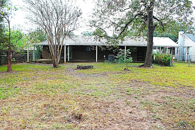 rear view of property with central air condition unit