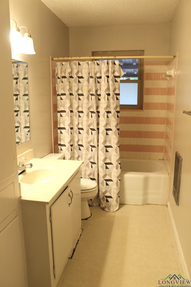 full bathroom featuring vanity, toilet, a textured ceiling, and shower / tub combo