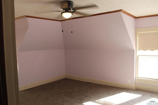 bonus room with ceiling fan and carpet floors