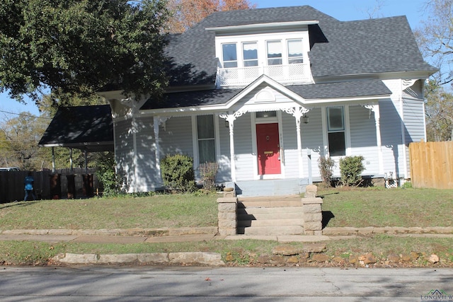 bungalow-style house with a front lawn