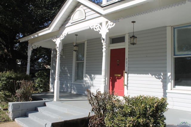 property entrance with covered porch