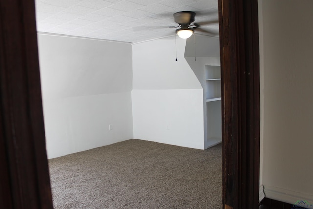 additional living space featuring ceiling fan and carpet floors