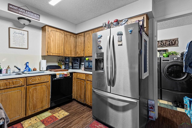 kitchen featuring washer / clothes dryer, stainless steel fridge with ice dispenser, dark wood-type flooring, black microwave, and a textured ceiling