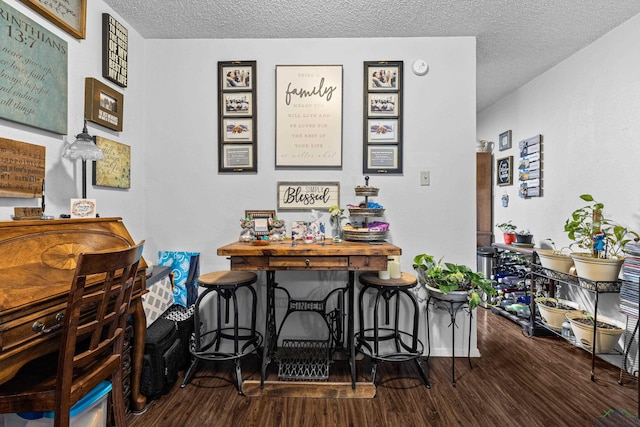 office featuring a textured ceiling and wood finished floors