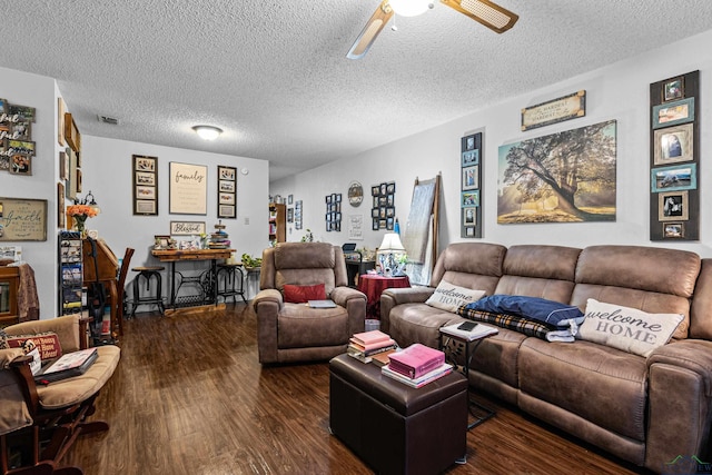 living area with ceiling fan, visible vents, a textured ceiling, and dark wood-style floors