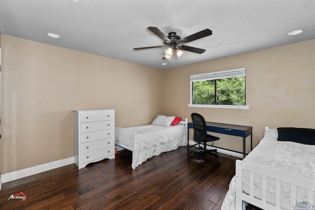 bedroom with ceiling fan and dark hardwood / wood-style floors