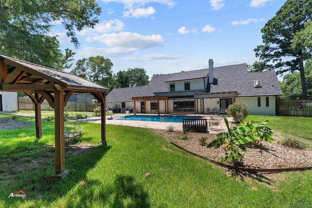 exterior space featuring a fenced in pool, a yard, a pergola, a gazebo, and a patio area