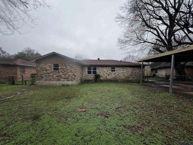 rear view of house with a lawn