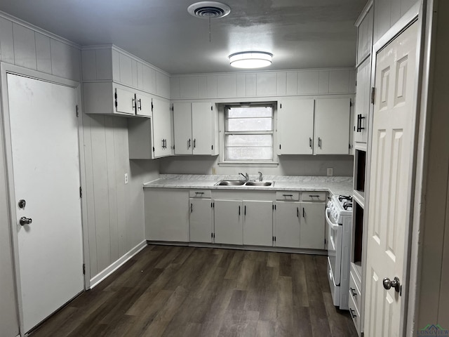 kitchen featuring white cabinetry, sink, dark hardwood / wood-style floors, and white range