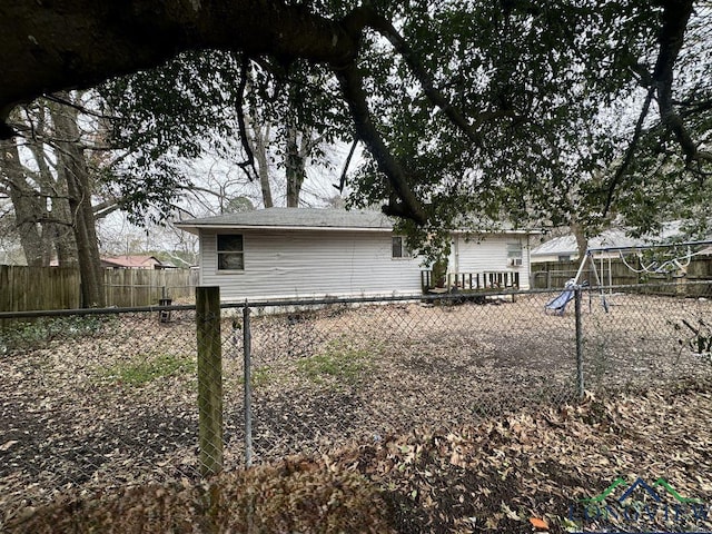 rear view of house with a playground