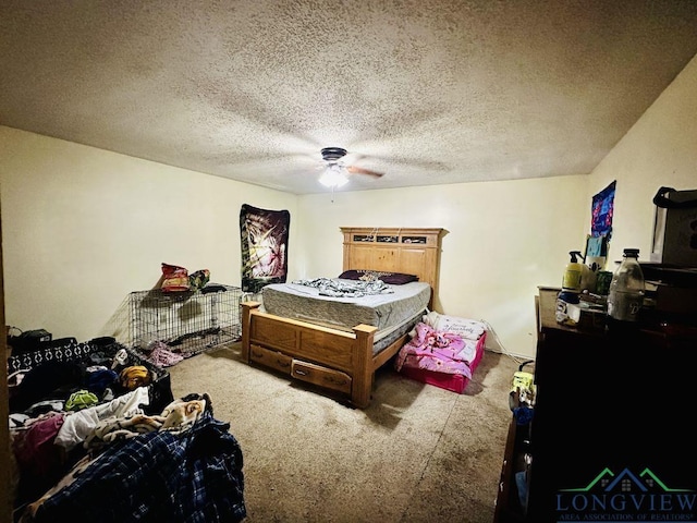 bedroom featuring ceiling fan and a textured ceiling