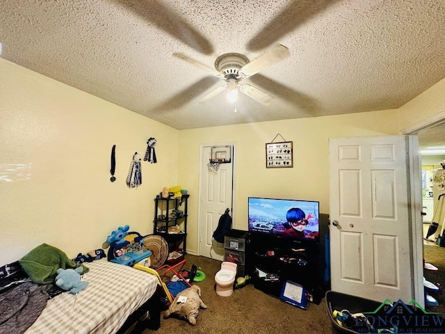 bedroom with carpet flooring, ceiling fan, and a textured ceiling