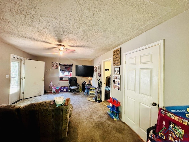 rec room with a textured ceiling and carpet floors