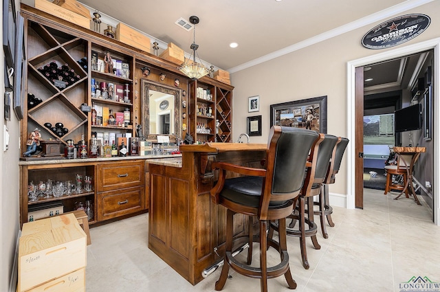 bar with crown molding and decorative light fixtures