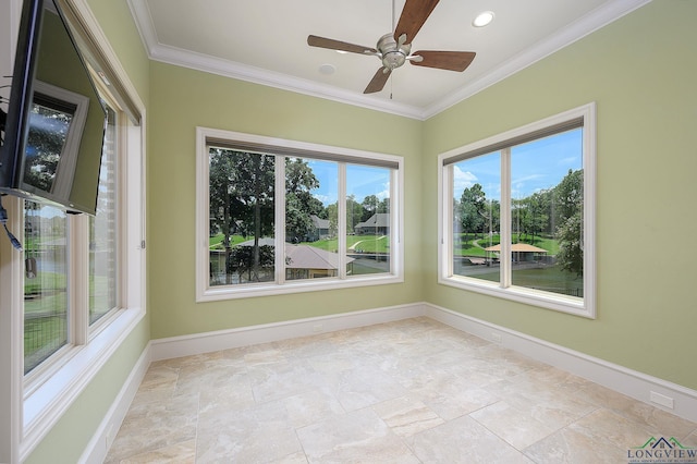 unfurnished sunroom featuring ceiling fan