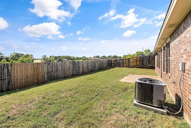 view of yard featuring a patio area and central AC