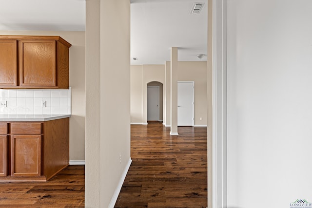 hallway featuring dark wood-type flooring