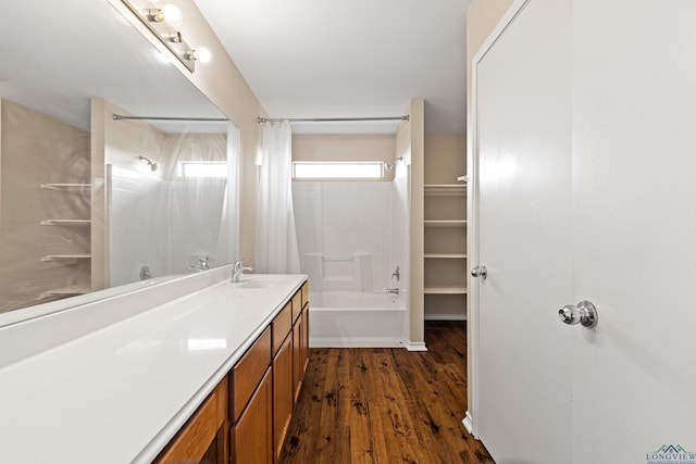 bathroom with wood-type flooring, vanity, and shower / bathtub combination with curtain