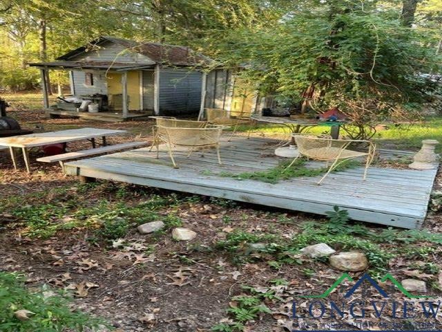 wooden terrace with an outdoor structure