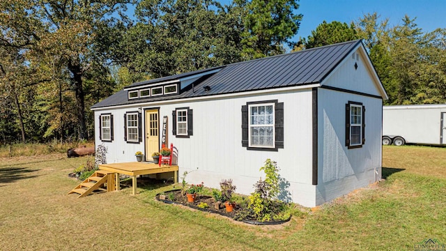 view of outbuilding featuring a yard