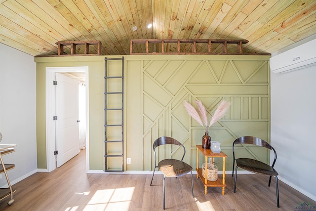 living area with a wall unit AC, light hardwood / wood-style flooring, and wooden ceiling