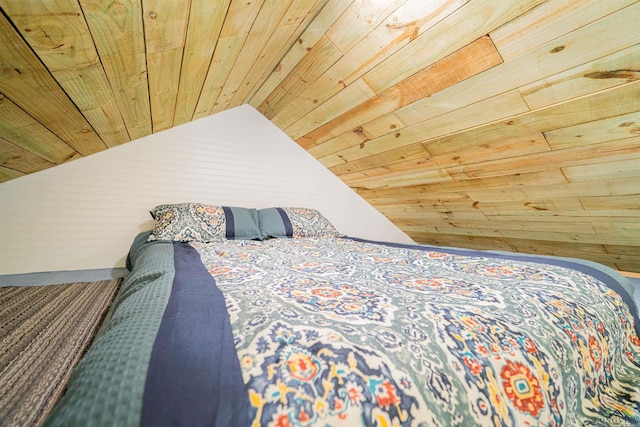 bedroom featuring wooden ceiling and lofted ceiling