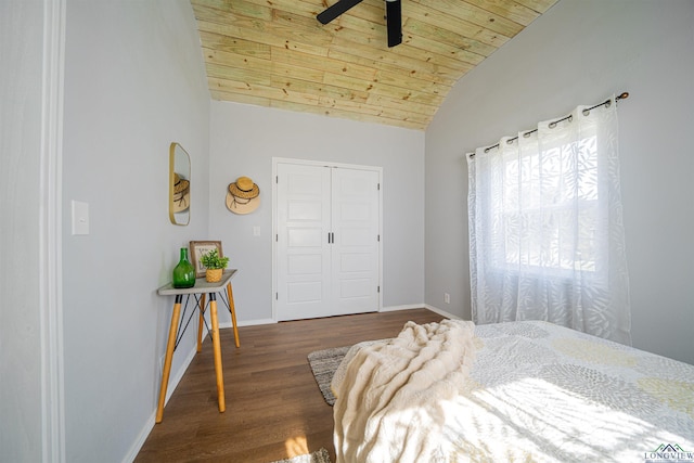 bedroom featuring wooden ceiling, dark wood-type flooring, vaulted ceiling, ceiling fan, and a closet