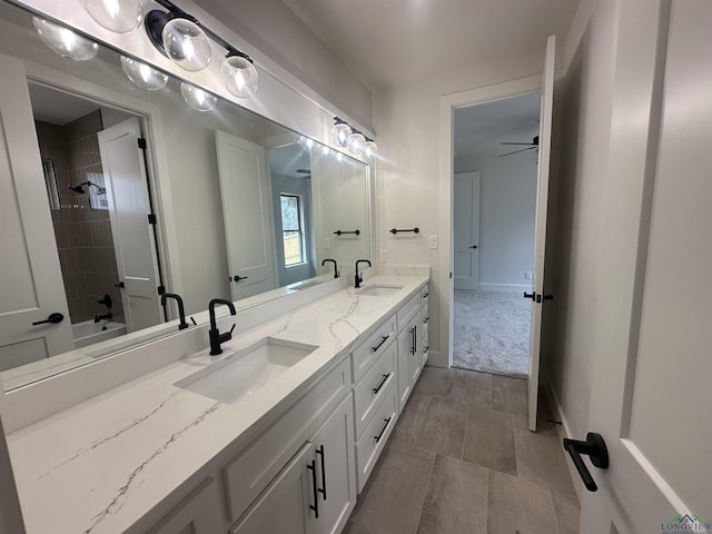 full bathroom with a sink, shower / bathtub combination, and double vanity