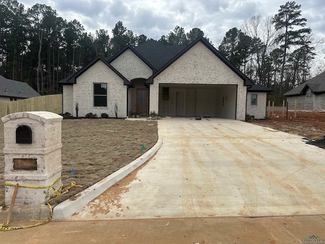 french provincial home with a carport