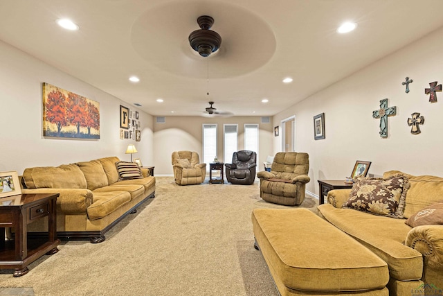 living room with carpet flooring and ceiling fan