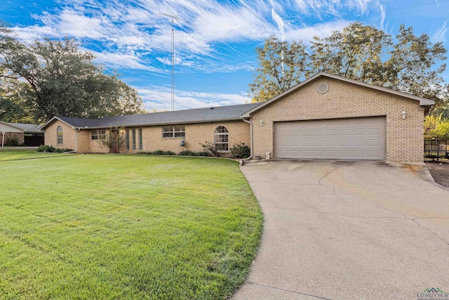 ranch-style home with a front yard and a garage