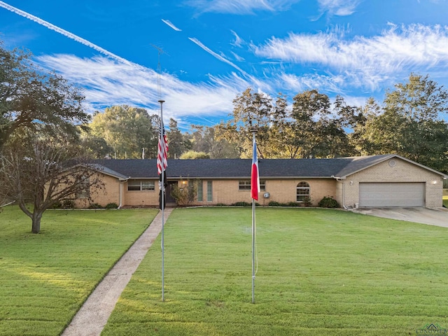 ranch-style home with a garage and a front yard