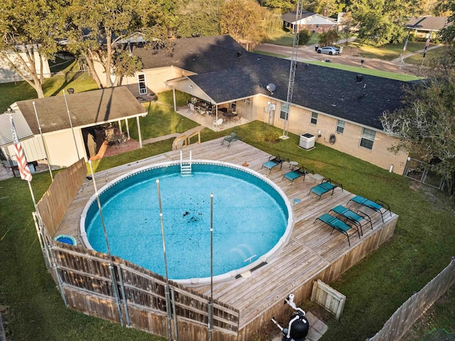 view of pool with a patio area and central AC