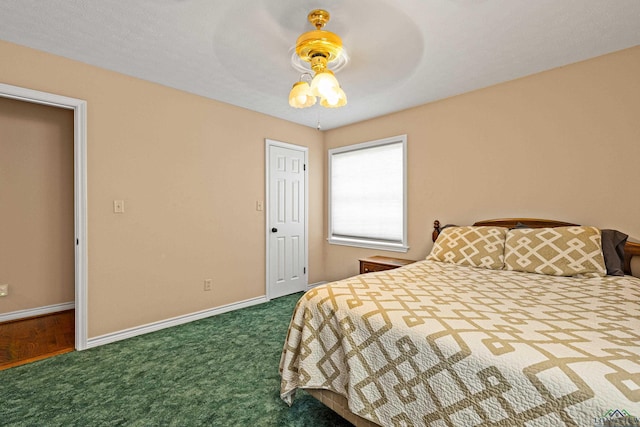 carpeted bedroom with ceiling fan and a closet