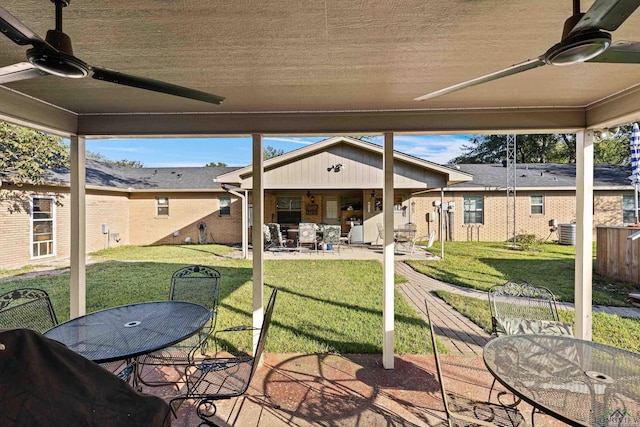 exterior space with ceiling fan