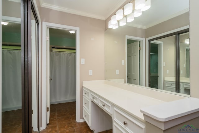 bathroom featuring crown molding and vanity