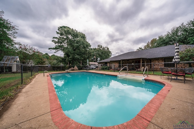 view of pool with a patio