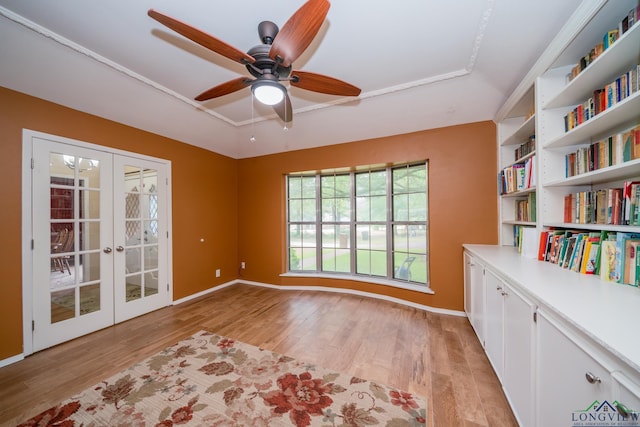 interior space with ceiling fan, french doors, and light hardwood / wood-style flooring