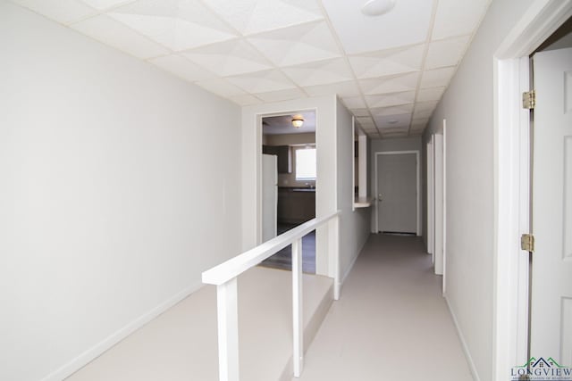 corridor featuring a drop ceiling